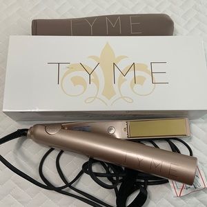 Tyme flat iron. New. Still in original box.